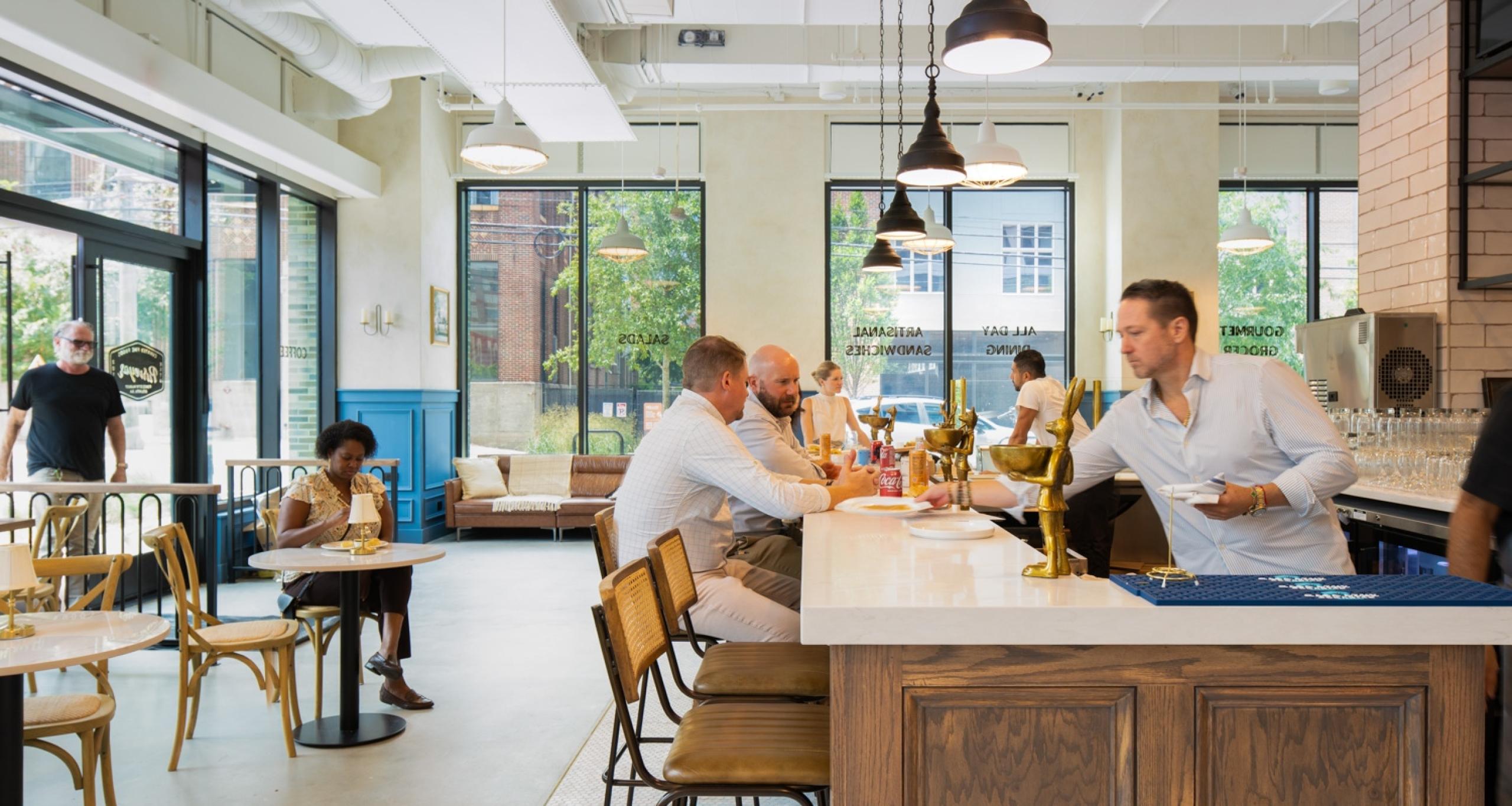 Customers inside the Necessary Purveyor coffee shop at Ponce City's Market's Scout Living
